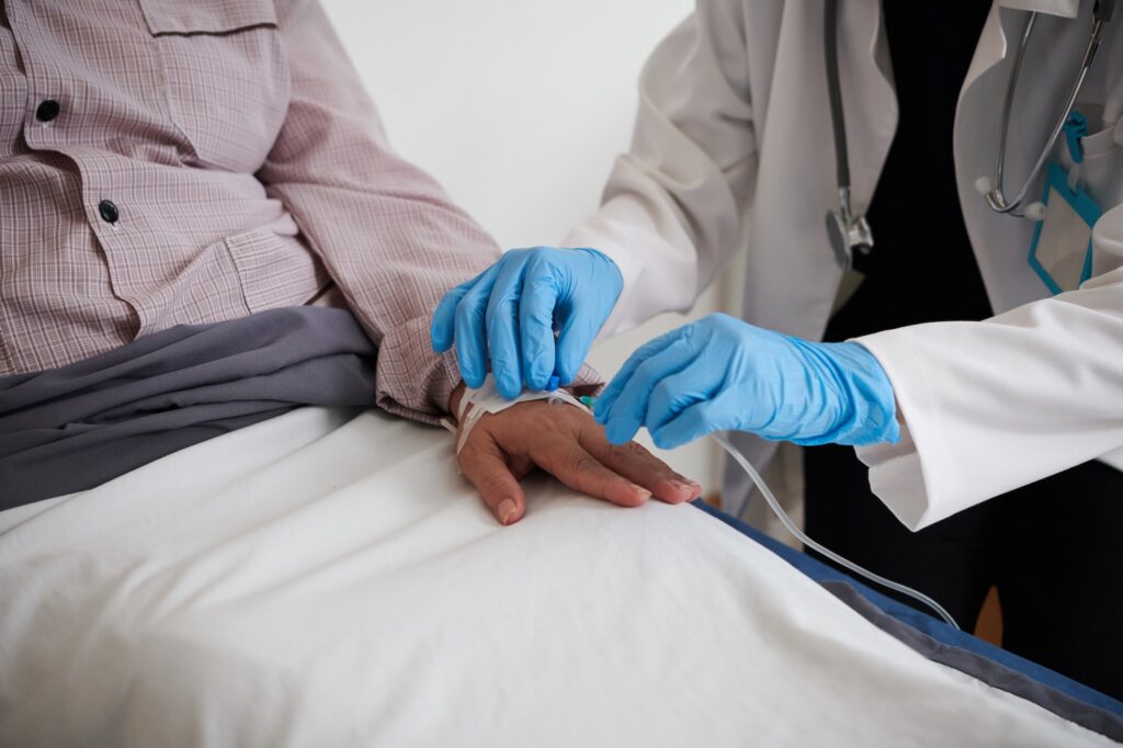Doctor Inserting IV Catheter